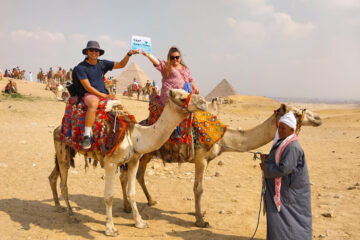 Wonderful pictures of the couple riding camels from the pyramids area